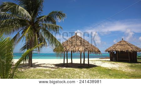 Beach With White Sand With Beach House On A Tropical Island Daco. Beautiful Sky, Sea, Resort. Seasca