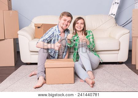 Beautiful Family With Boxes And Holding Flat Keys