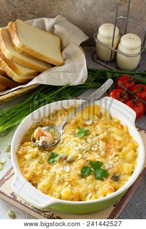 Casserole Crumble With Red Fish, White Bread And Cheese On Stone Or Slate Background. Proper Nutriti