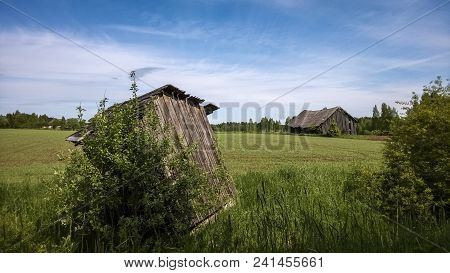 The Old Rickety Shed In The Field In Summer.