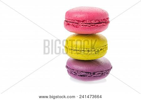Sweet Tasty Macaroons On Eath Other Isolated On A White Background.