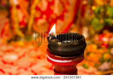 Lit Clay Lamp On Top Of A Clay Stand Or Worship Idol Durgapuja India Diwali