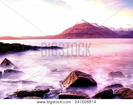 Rocks Near Elgol,  Loch Scavaig,  Isle Of Skye Scotland. Warm Sunset Colors In Cold February Evening