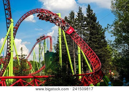 Saint-petersburg. Russia. 05.17.2018 Roller Coasters And Swings People Have Fun Good Weather