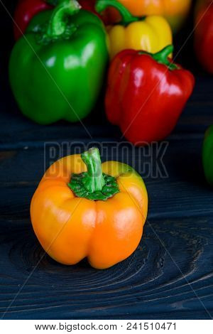 Ripe Bulgarian Pepper On The Black  Table