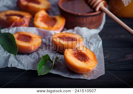 Sweet Ripe Peach On The Black Table