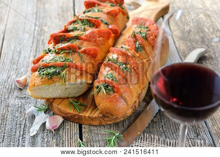 Spanish Food: Roasted Bread With Herb Butter And Hot Chorizo Salami Fresh From The Oven Served With 