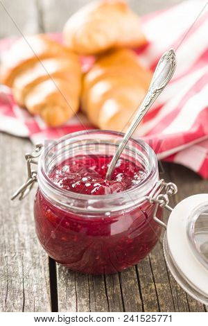 Raspberry jam jelly in jar.