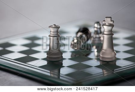 Chess Board With Glass Pieces. Chessmate Position. Black And White Image