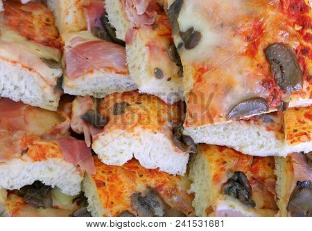 Slices Of Pizza With Mushrooms And Ham Prepared For A Business Buffet