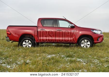Slany, Czech Republic - November 10, 2016: Red Toyota Hilux In Slany, Czech Republic, November 10, 2