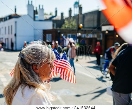 Windsor, United Kingdom - May 19, 2018: Senior Woman Selling American Usa Flags For Royal Wedding Ma