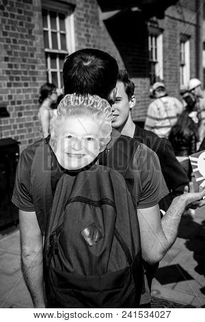 Windsor, Berkshire, United Kingdom - May 19, 2018: Man With Masks Of Queen Elizabeth Ii Heading Roya