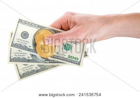 Two Golden Bitcoin On Us Dollars In A Man Hand. Digitall Symbol Of A New Virtual Currency.electronic