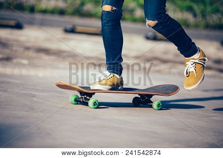 One Skateboarder Legs Skateboarding On Paking Lot
