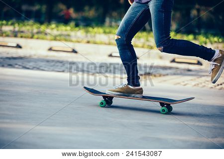 One Skateboarder Legs Skateboarding On Paking Lot