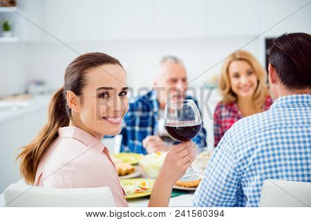 Brunette, Charming, Pretty, Attractive, Festive Girl Holding Glass Of Wine In Hand Looking At Camera