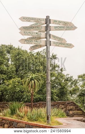 A Signpost, Showing The Distances To Famous Waterfall Of The World, At The Howick Falls, In Howick, 
