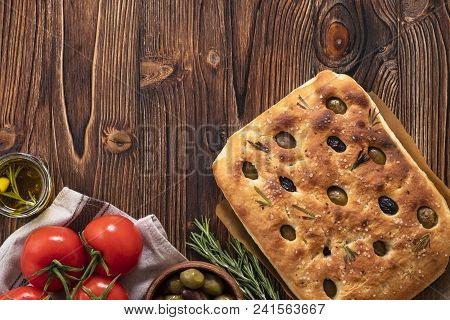 Traditional Italian Focaccia With Olives, Rosemary - Homemade Flat Bread Focaccia. Rustic Style. Top