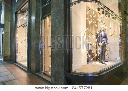 MILAN, ITALY - CIRCA NOVEMBER, 2018: shop window display of clothing at a Massimo Dutti store in Milan, Italy.