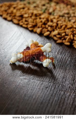 Calcium Bones For Dog Feeding On Wooden Background
