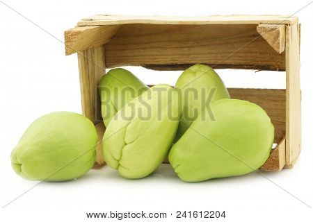 Chayote fruit (Sechium edulis)and a cut one on a white background
