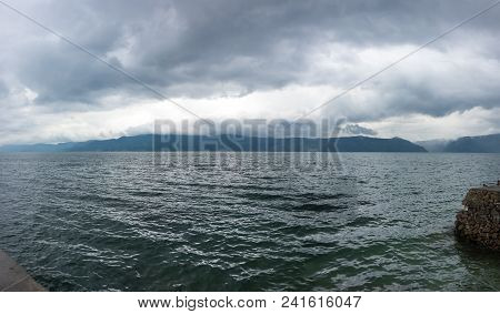 Lake Toba Is A Large Natural Lake Occupying The Caldera Of A Supervolcano, Located In The Middle Of 