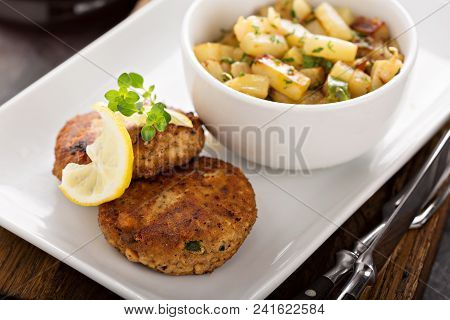 Crab Cakes With A Side Of Potatoes