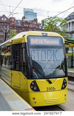 A Tram On The Metrolink Light Rail System In The City Centre Of