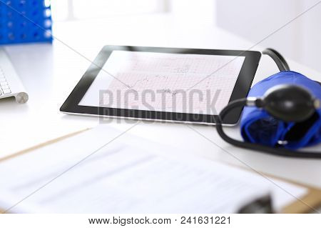 Workplace Of Doctor. Tablet Ps Showing Heart Diagrams Closeup. Healthcare And  Cardiology In Medicin