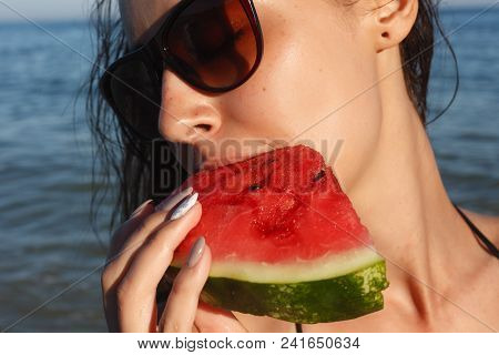 Summer Vacation - Young Girl Eating Fresh Watermelon On Sandy Beach