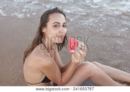 Summer Vacation - Young Girl Eating Fresh Watermelon On Sandy Beach