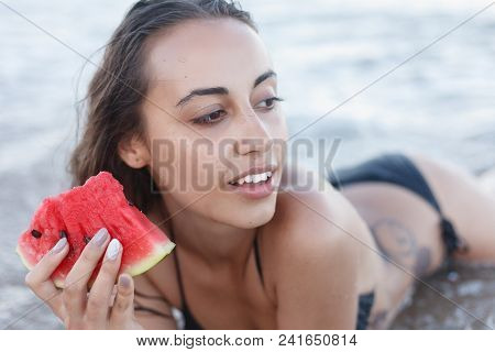 Summer Vacation - Young Girl Eating Fresh Watermelon On Sandy Beach