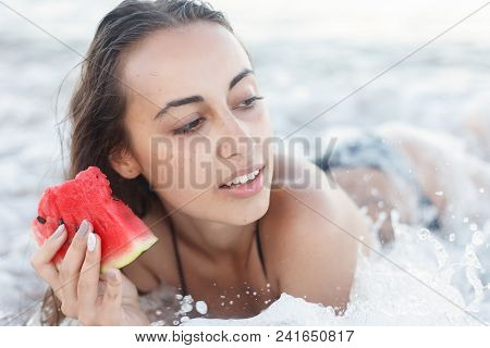 Summer Vacation - Young Girl Eating Fresh Watermelon On Sandy Beach