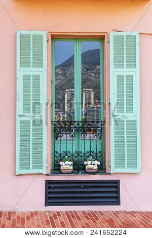 Window With Shutters In Monaco-ville, Monaco. Monaco-ville Is One Of The Four Traditional Quarters O