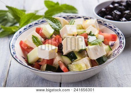 Greek salad with feta cheese cubes and fresk vegetables