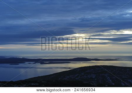 Silhouette Of Schoodic Peninsula During Cloudy Sunrise At Cadillac Mountain