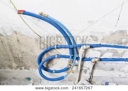 Water Pipes Made Of Polypropylene Pex In The Wall, Plumbing In The House. Installation Of Sewer Pipe