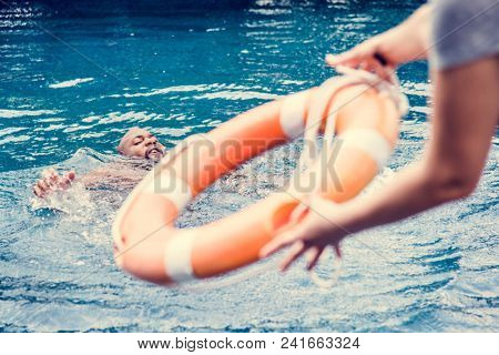 Man being rescued from the water