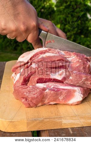Overhead View Of Raw Piece Of Pork On Wooden Background. Piece Of Fresh Boneless Pork, Neck Part Or 