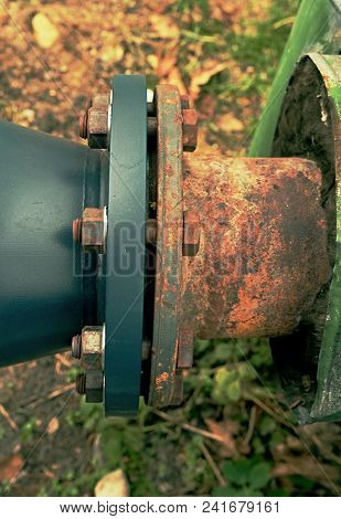 Flanges And Valves Are Mounted On A Ground Made Of Welded Steel Pipes. Metal Pipe Flanges With Bolts
