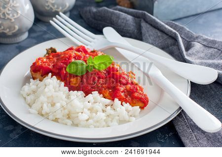 Flounder With Tomato Sauce And Boiled Rice, Selective Focus