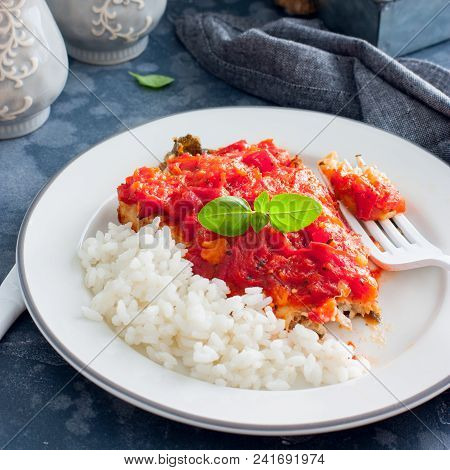 Flounder With Tomato Sauce And Boiled Rice, Selective Focus