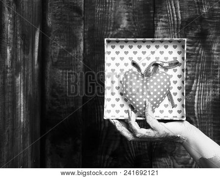 Female Hand Smeared In Golden Paint Or Glister Holding Handmade Pink Polka Dots Valentine Heart In P