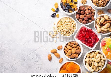 Assortment Of Nuts And Dried Fruits In Bowls. Cashew, Hazelnuts, Walnuts, Almonds, Brazilian Nuts, R