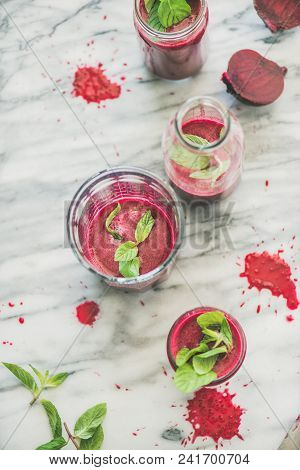 Fresh Morning Beetroot Smoothie Or Juice In Glasses With Mint Leaves Over Grey Marble Background, Co
