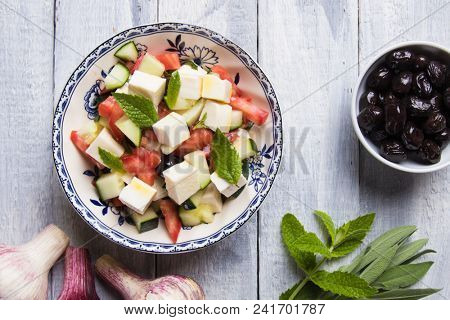 Greek salad with feta cheese cubes and fresk vegetables