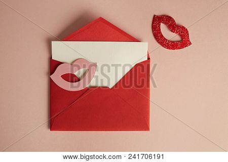Mockup Red Envelope And White Blank Sheet On Empty Pink Color Desk. Business Empty Mock-up Backgroun