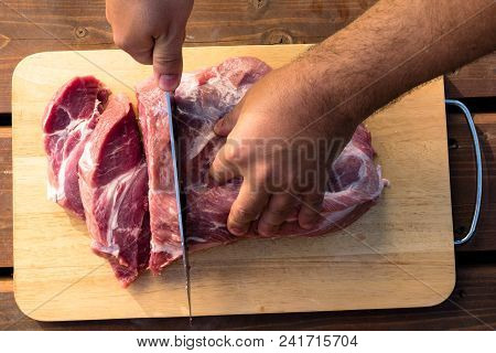 Overhead View Of Raw Piece Of Pork On Wooden Background. Piece Of Fresh Boneless Pork, Neck Part Or 