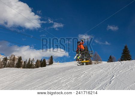 Skier In Action: Ski Jumping In The Mountain Snowpark.